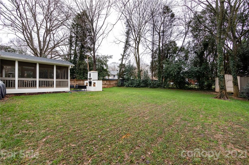 1417 Burnley Road Charlotte, NC 28210 - Photo 39 of 43 a view of a house with backyard and trees