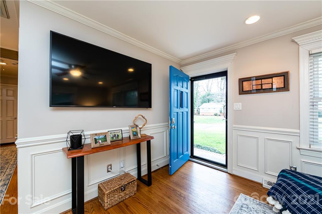 1417 Burnley Road Charlotte, NC 28210 - Photo 6 of 43 a view of a livingroom with wooden floor and furniture