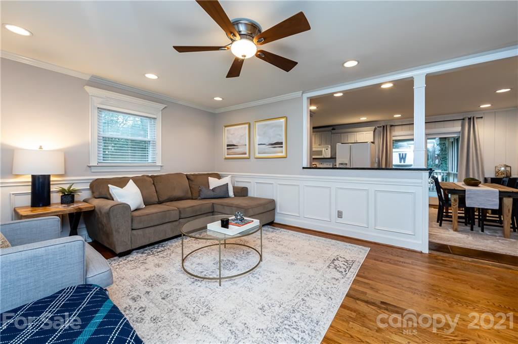 1417 Burnley Road Charlotte, NC 28210 - Photo 8 of 43 a living room with furniture and a wooden floor