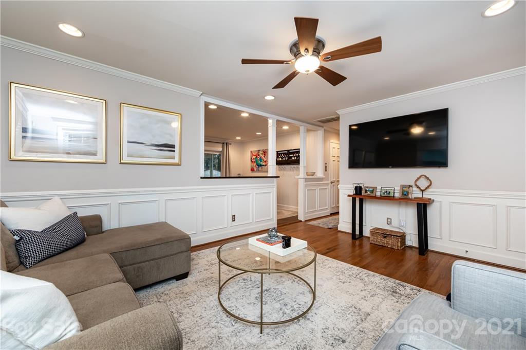 1417 Burnley Road Charlotte, NC 28210 - Photo 9 of 43 a living room with furniture and a flat screen tv