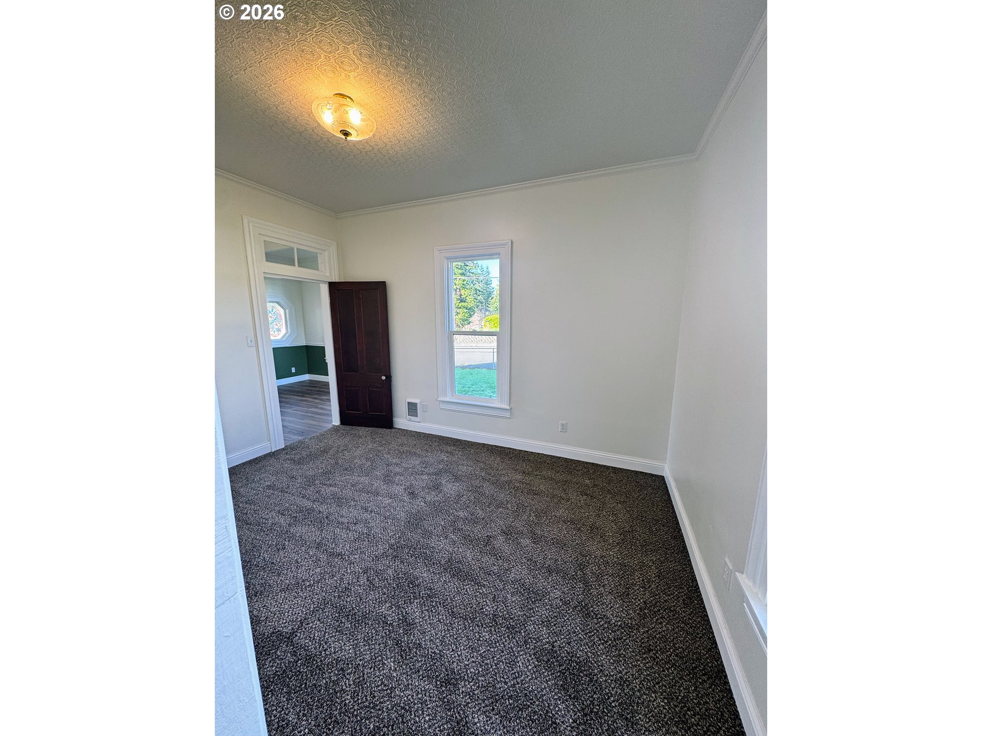 584 North Baxter Street Coquille, OR 97423 - Photo 13 of 39 a view of an empty room with a window