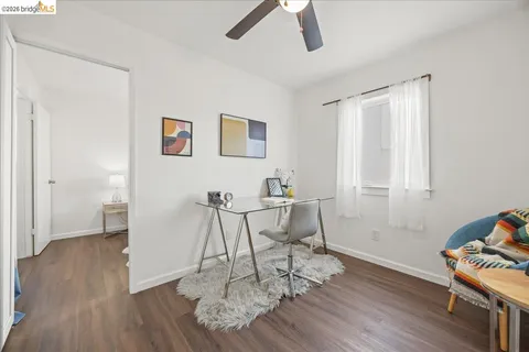 a view of a livingroom with furniture and wooden floor