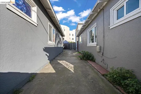 a view of a pathway with a house in the background