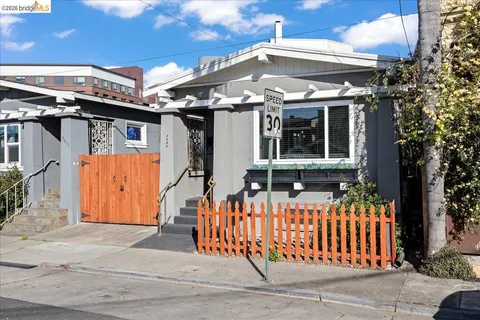 a view of a house with a iron gate