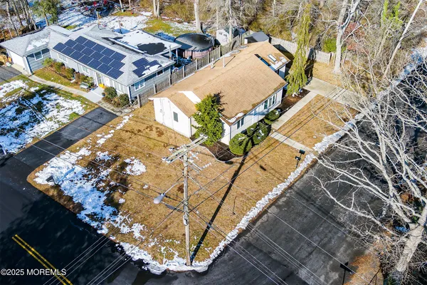 a view of a backyard with sitting area
