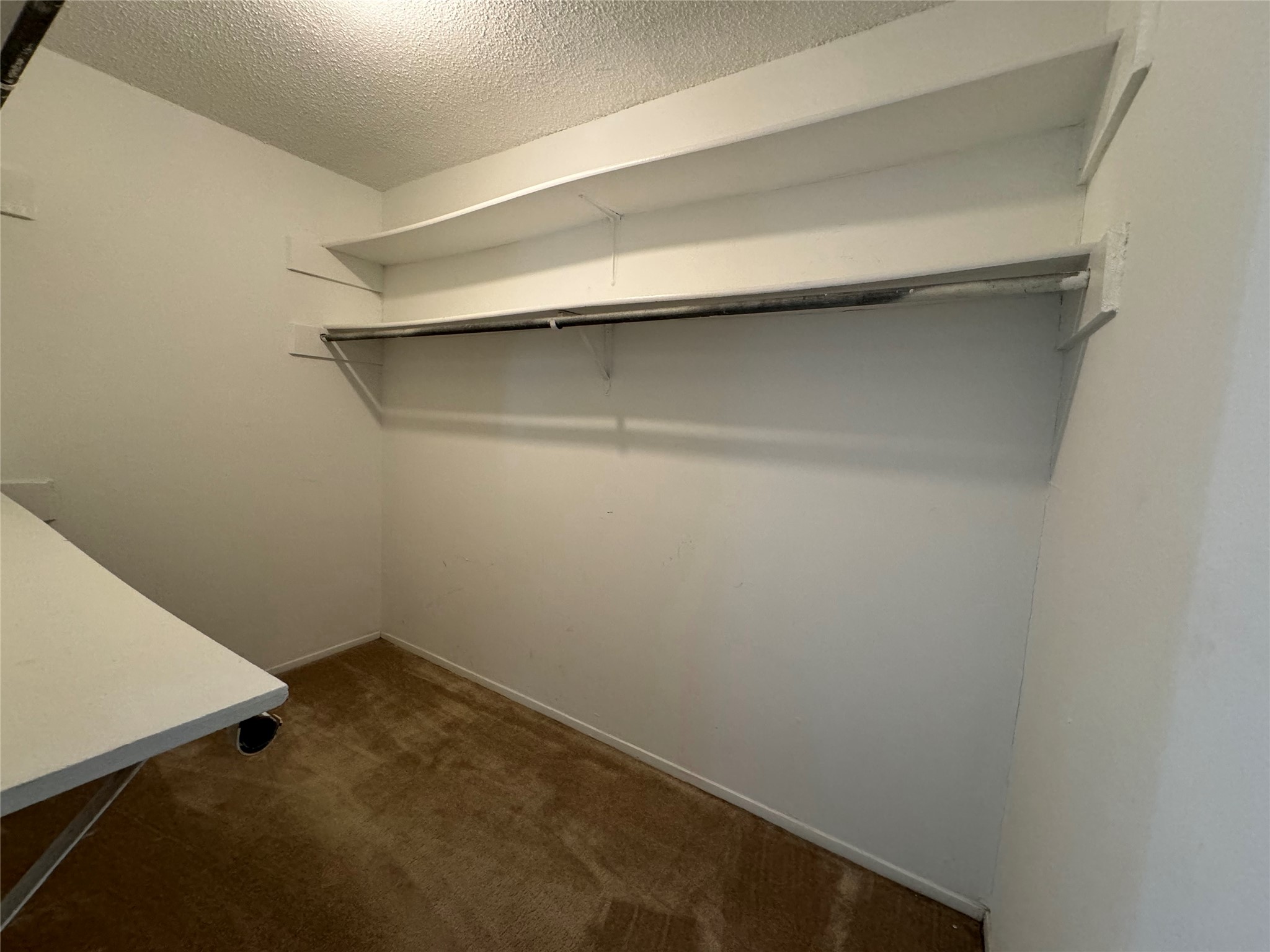 910 Duncan Lane, Unit 43 Austin, TX 78705 - Photo 11 of 15 a small space with a wooden floor and a window