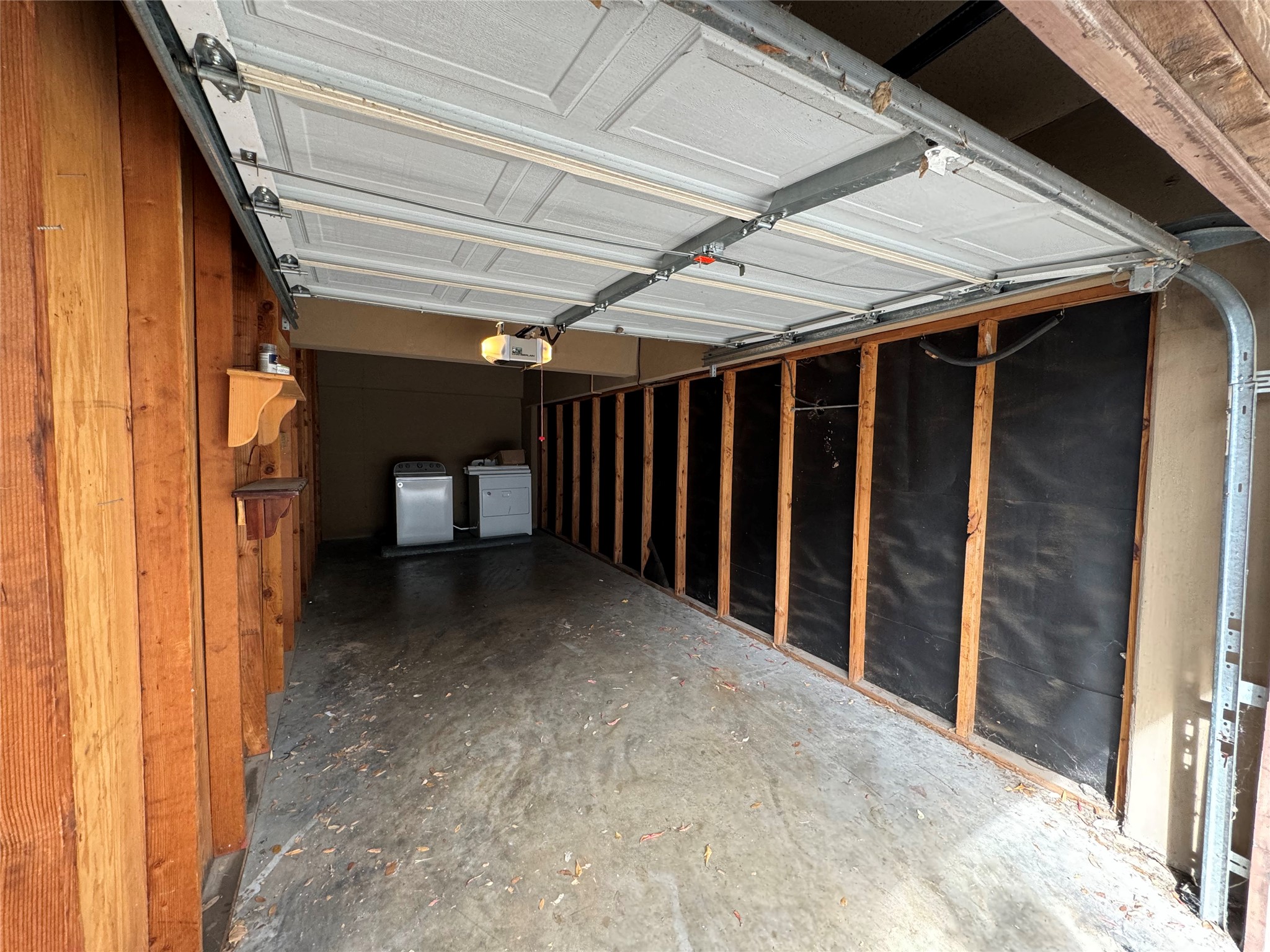 910 Duncan Lane, Unit 43 Austin, TX 78705 - Photo 12 of 15 a view of backyard with garage
