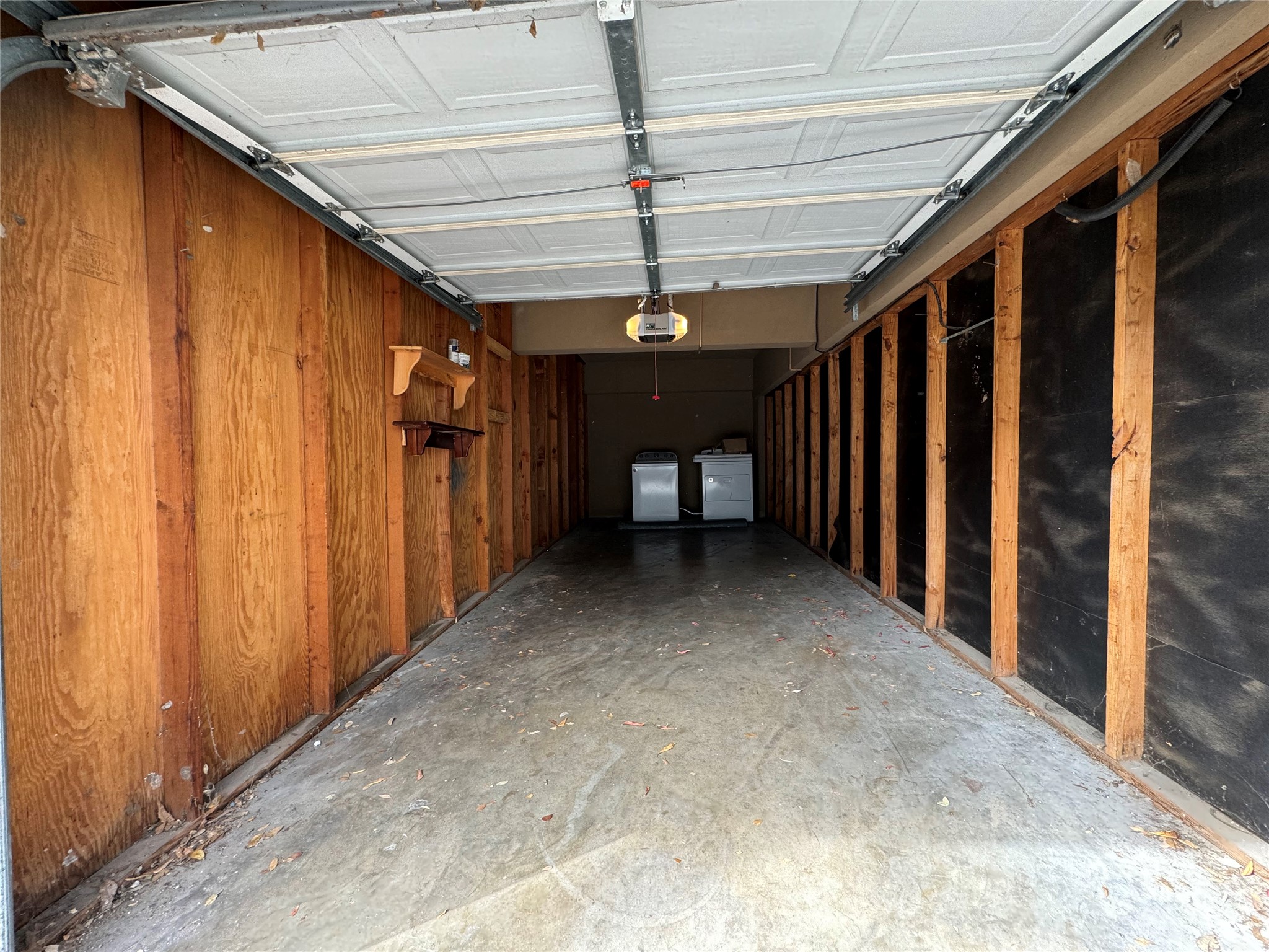 910 Duncan Lane, Unit 43 Austin, TX 78705 - Photo 14 of 15 a view of a hallway with a garage