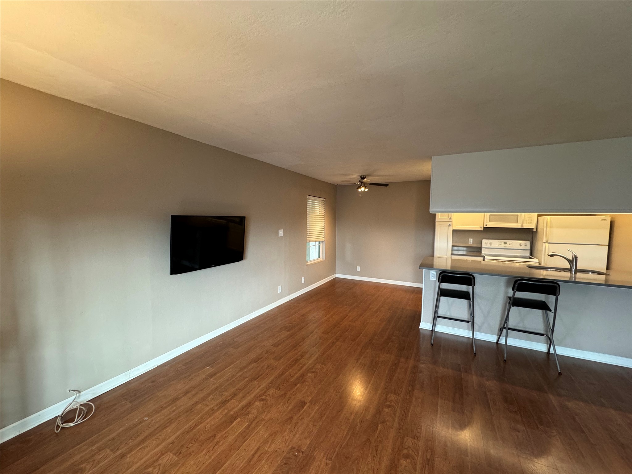 910 Duncan Lane, Unit 43 Austin, TX 78705 - Photo 2 of 15 a view of a livingroom with furniture and wooden floor