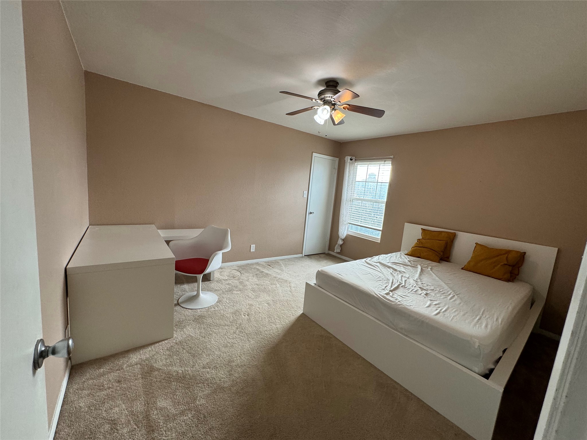 910 Duncan Lane, Unit 43 Austin, TX 78705 - Photo 5 of 15 a bed room with a bed mirror and a chandelier