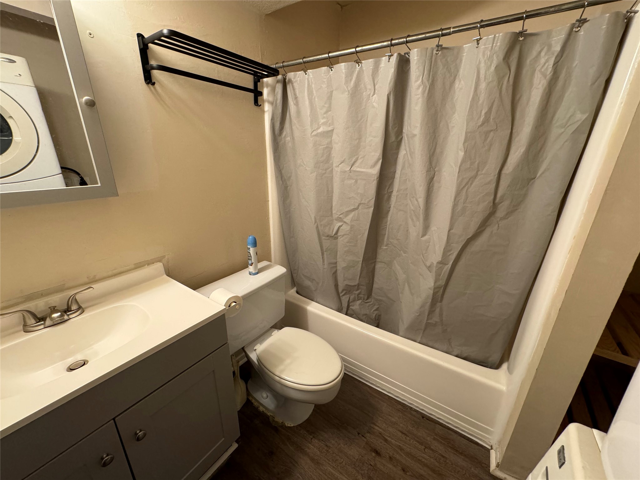 910 Duncan Lane, Unit 43 Austin, TX 78705 - Photo 7 of 15 a bathroom with a sink a toilet a mirror and shower