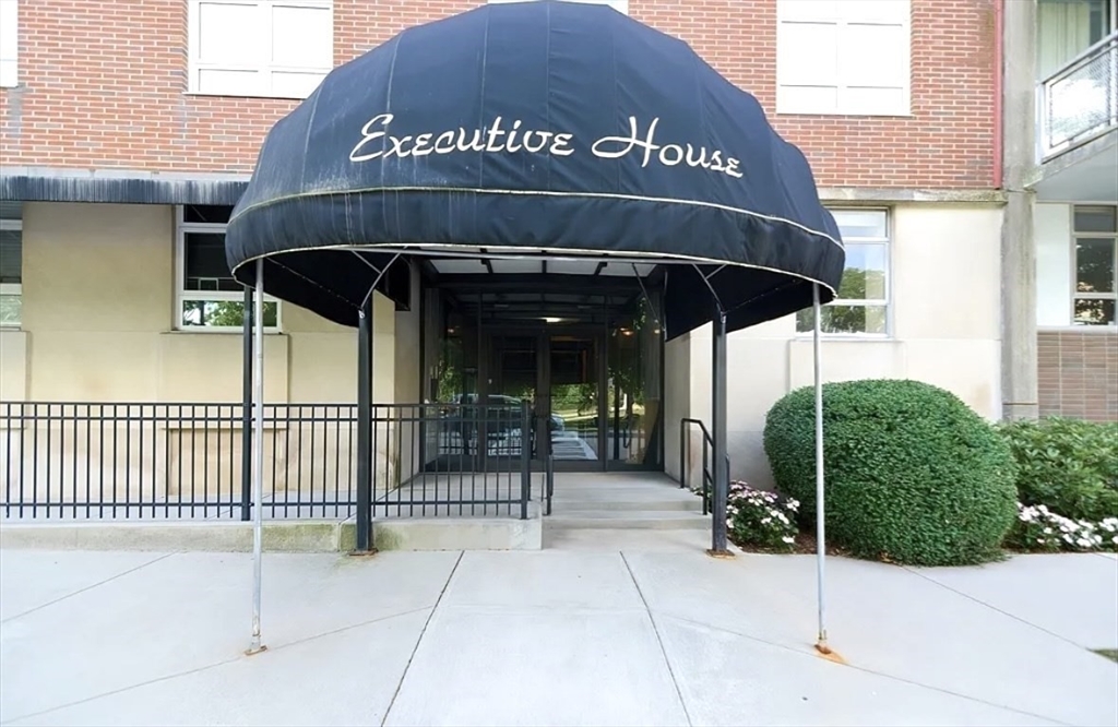 80 Salisbury Street, Unit 308 Worcester, MA 01609 - Photo 1 of 25 a front view of a building with a garden