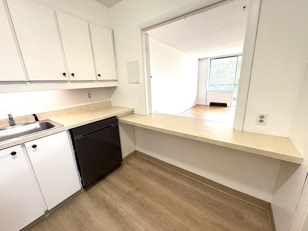 80 Salisbury Street, Unit 308 Worcester, MA 01609 - Photo 8 of 25 a kitchen with a sink and cabinets
