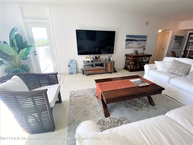 a lobby with furniture and wooden floor