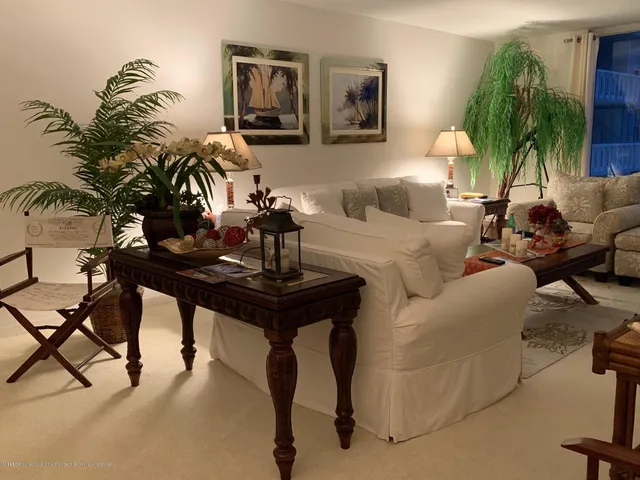 a view of a patio with a table and chairs