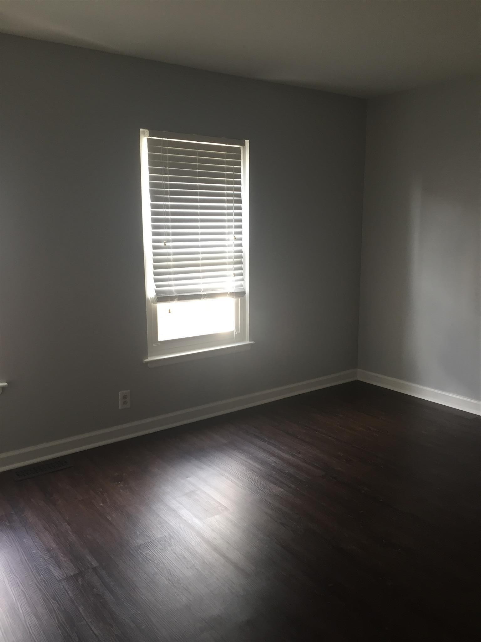 370 Wallace Road, Unit F9 Nashville, TN 37211 - Photo 7 of 14 a view of an empty room with wooden floor and a window