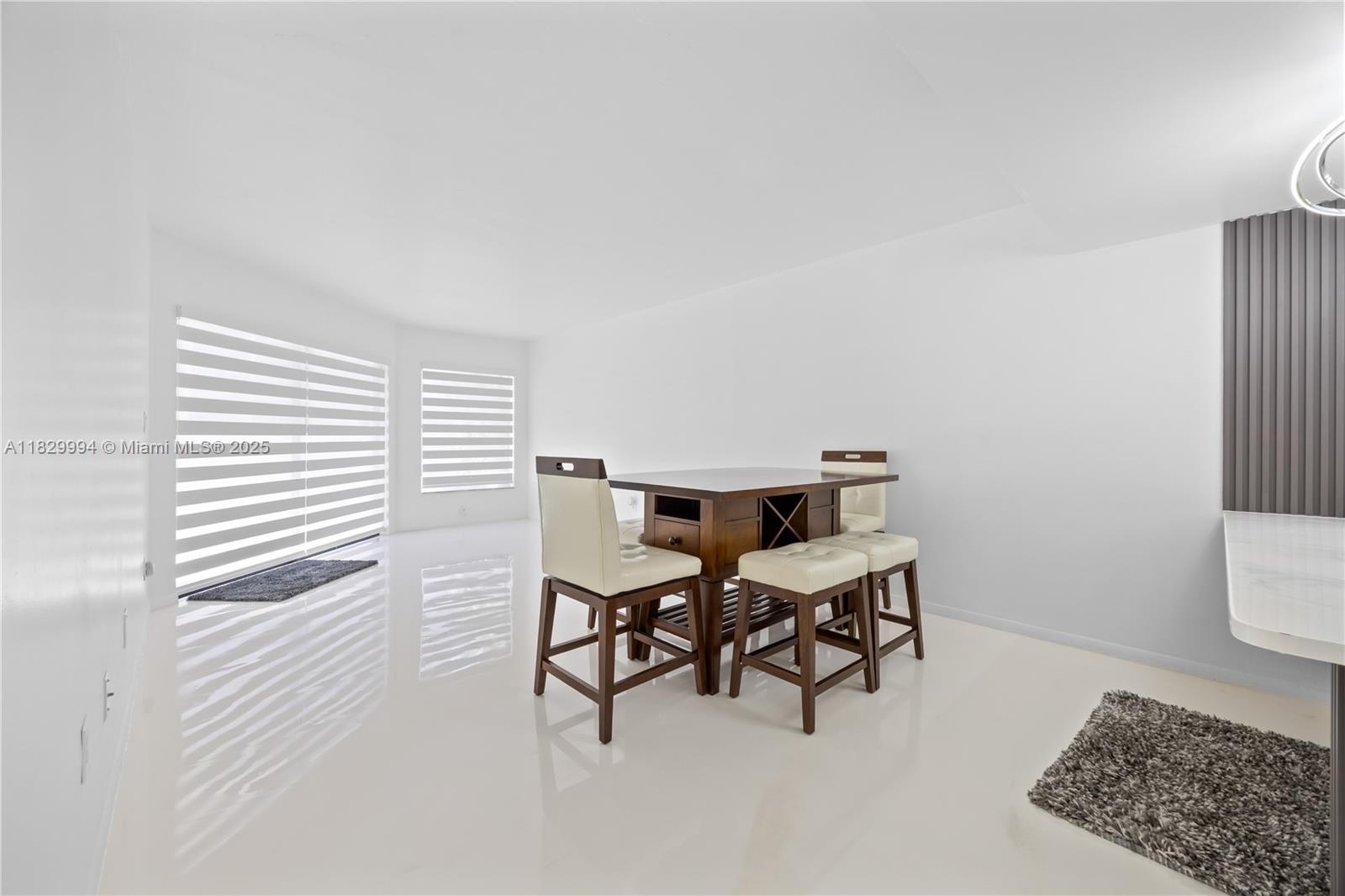 8810 Southwest 132nd Place, Unit 101DN Miami, FL 33186 - Photo 2 of 39 a view of a workspace with furniture and a window