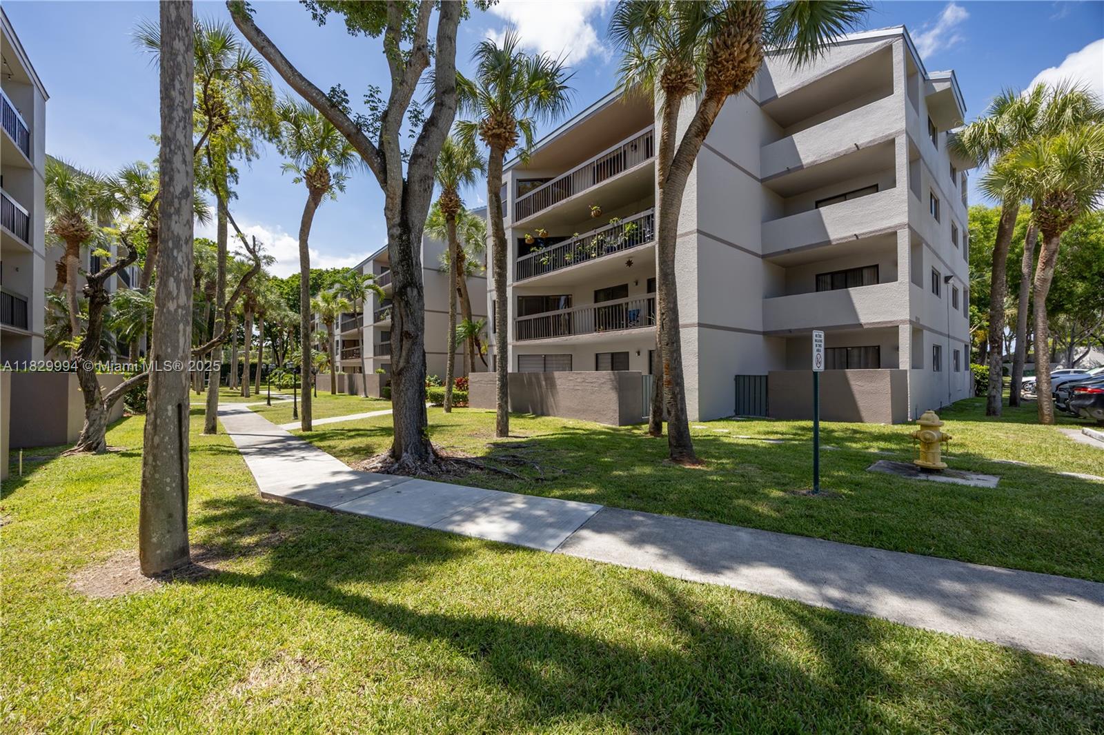 8810 Southwest 132nd Place, Unit 101DN Miami, FL 33186 - Photo 33 of 39 a view of a house with a yard