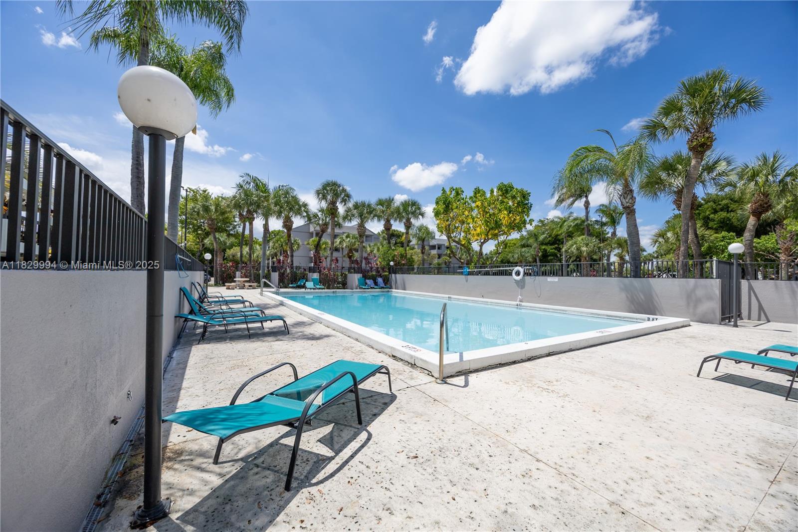 8810 Southwest 132nd Place, Unit 101DN Miami, FL 33186 - Photo 34 of 39 a view of a backyard