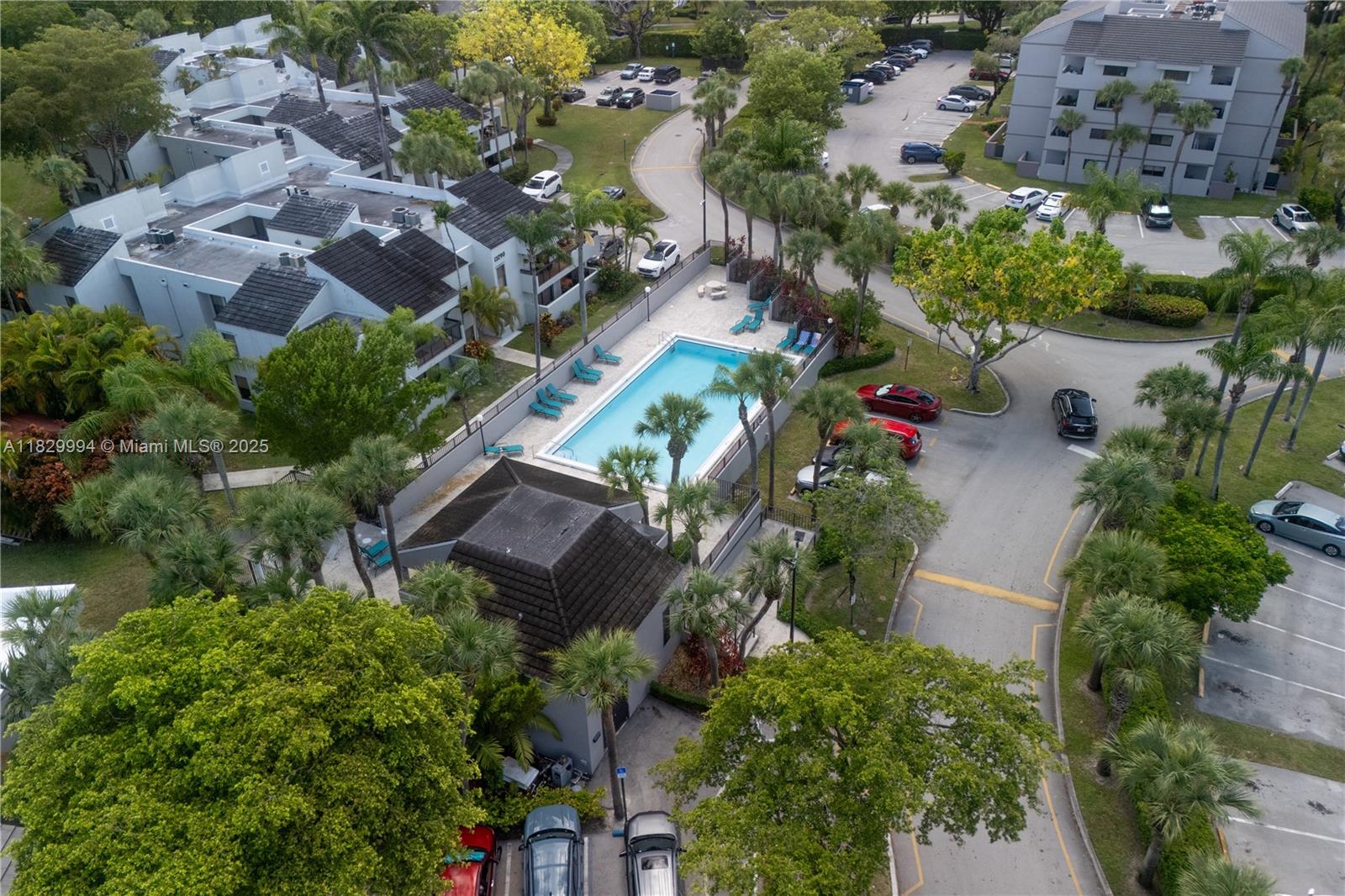 8810 Southwest 132nd Place, Unit 101DN Miami, FL 33186 - Photo 37 of 39 an aerial view of house with yard swimming pool and outdoor seating