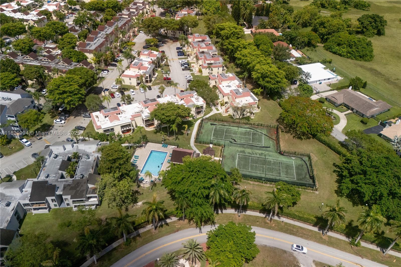 8810 Southwest 132nd Place, Unit 101DN Miami, FL 33186 - Photo 38 of 39 an aerial view of residential houses with outdoor space