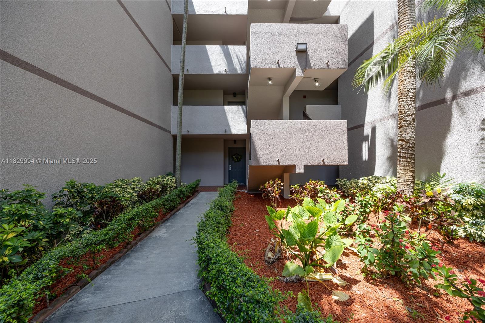 8810 Southwest 132nd Place, Unit 101DN Miami, FL 33186 - Photo 7 of 39 an aerial view of a house with a garden