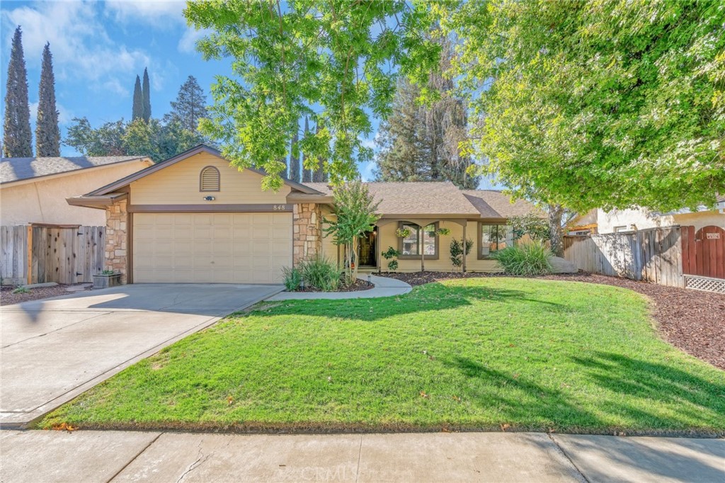 848 Lehigh Drive Merced, CA 95348 - Photo 1 of 30 a front view of a house with yard and green space