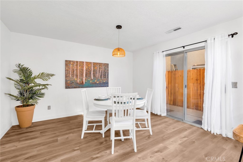 848 Lehigh Drive Merced, CA 95348 - Photo 12 of 30 a dining room with furniture and wooden floor