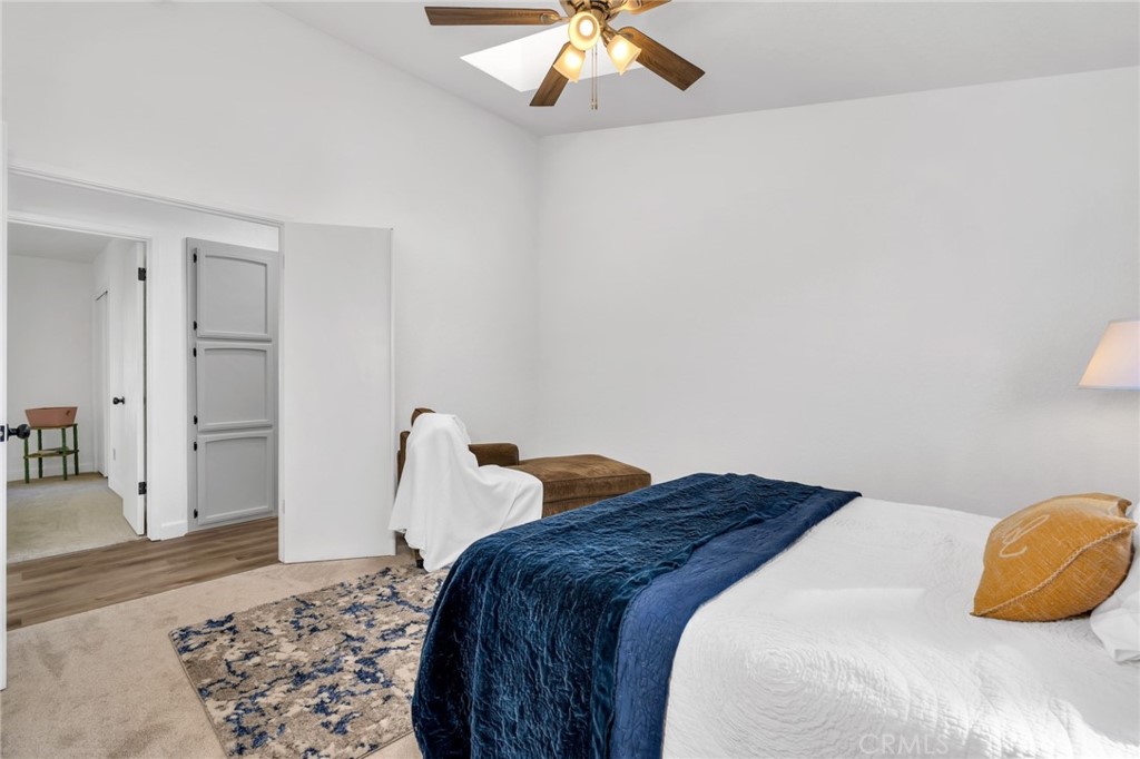 848 Lehigh Drive Merced, CA 95348 - Photo 16 of 30 a bedroom with a bed and a chandelier