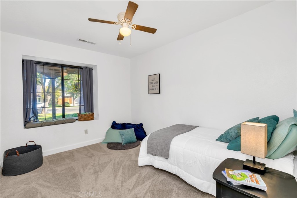 848 Lehigh Drive Merced, CA 95348 - Photo 19 of 30 a bedroom with bed window and couch