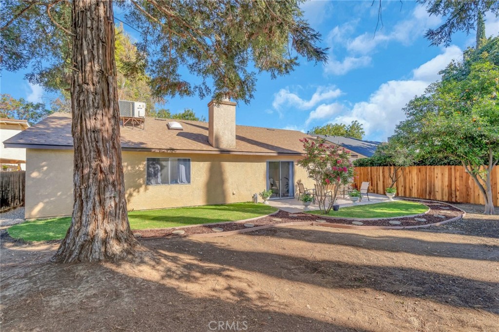 848 Lehigh Drive Merced, CA 95348 - Photo 25 of 30 a front view of a house with a yard and large trees