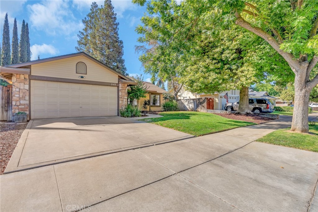848 Lehigh Drive Merced, CA 95348 - Photo 3 of 30 a front view of a house with a yard and garage