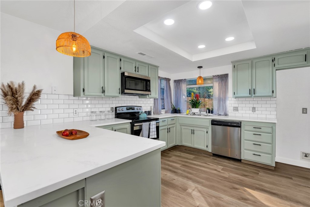 848 Lehigh Drive Merced, CA 95348 - Photo 8 of 30 a kitchen with white cabinets and appliances