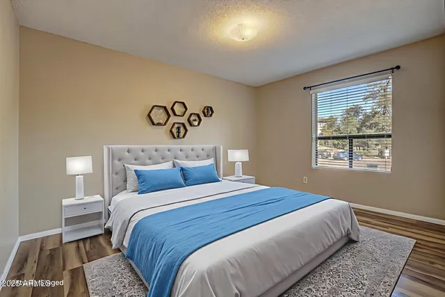 a bedroom with a bed and a window