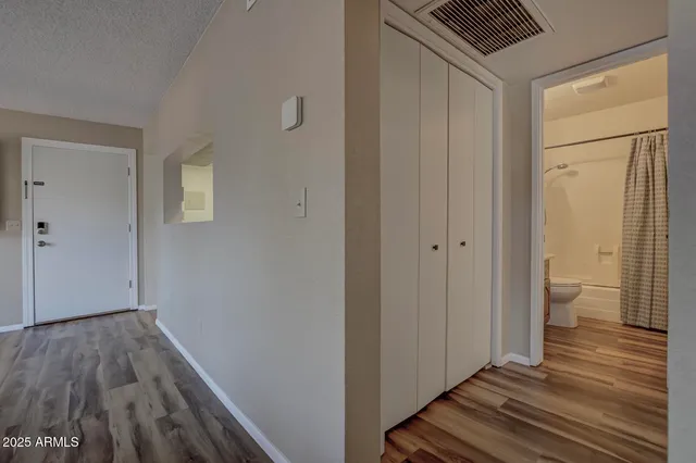 a view of a bathroom from a hallway