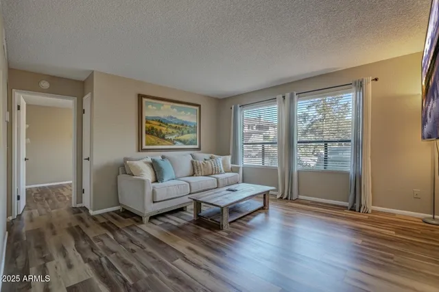 a living room with furniture and a large window