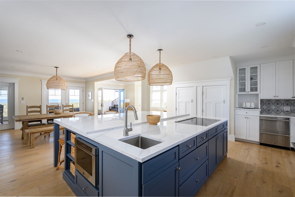 133 Beach Avenue Hull, MA 02045 - Photo 12 of 42 a kitchen with sink stove and cabinets