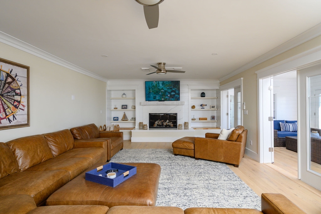 133 Beach Avenue Hull, MA 02045 - Photo 13 of 42 a living room with furniture fireplace and window