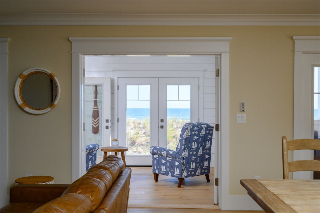 133 Beach Avenue Hull, MA 02045 - Photo 14 of 42 a living room with furniture and a potted plant