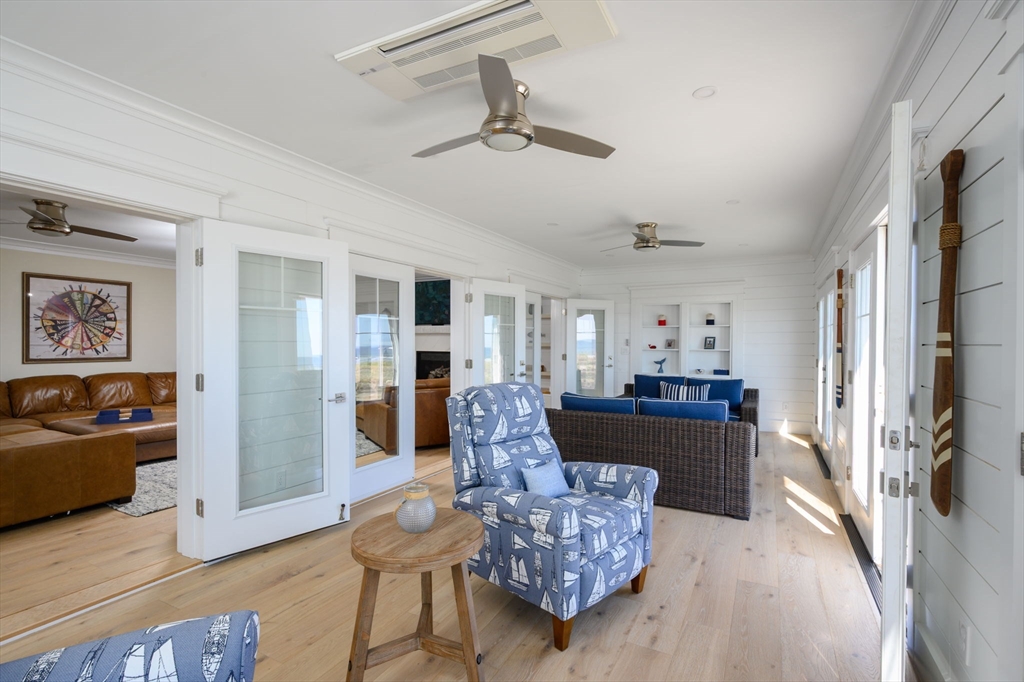 133 Beach Avenue Hull, MA 02045 - Photo 15 of 42 a living room with furniture and a fireplace
