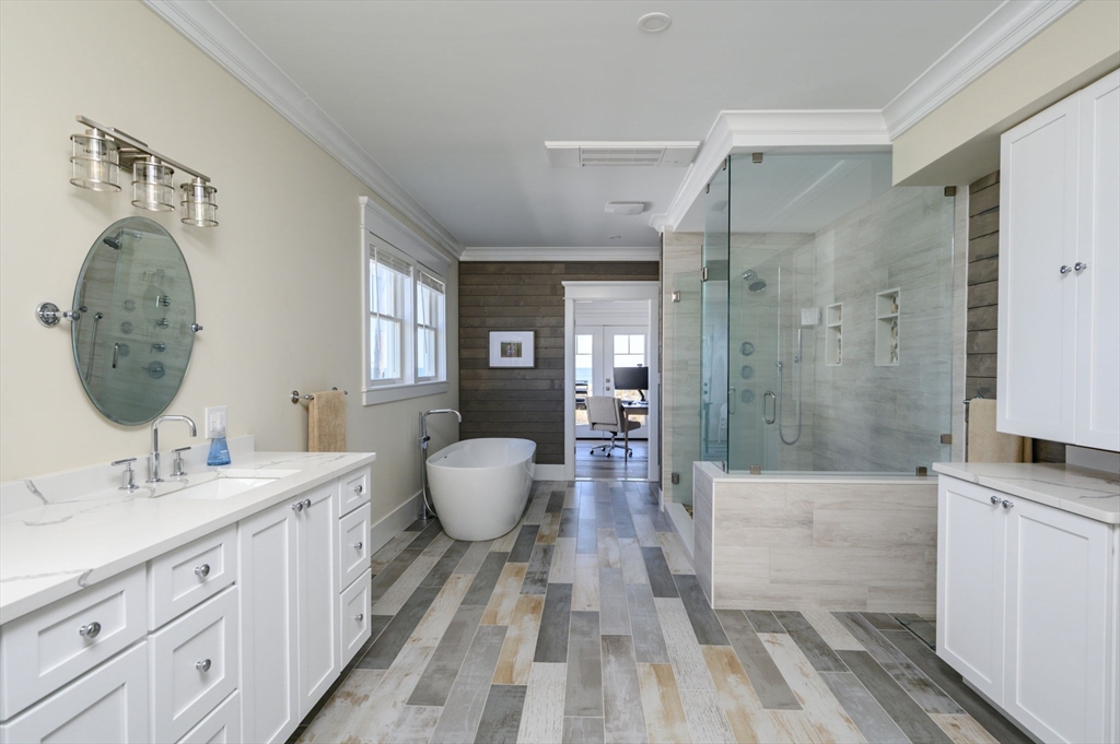 133 Beach Avenue Hull, MA 02045 - Photo 17 of 42 a spacious bathroom with a double vanity sink a mirror and a shower