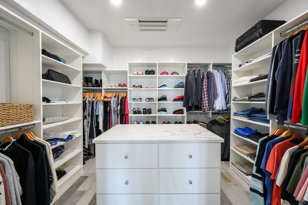 133 Beach Avenue Hull, MA 02045 - Photo 18 of 42 a view of walk in closet with clothes and shoes