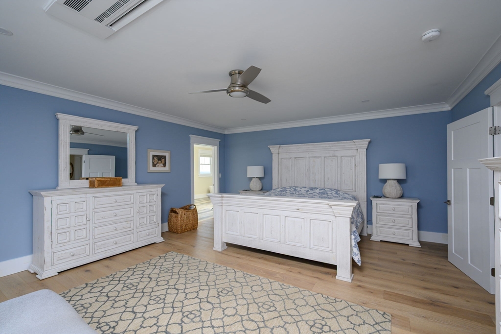 133 Beach Avenue Hull, MA 02045 - Photo 19 of 42 a room with a bed and a dresser in it
