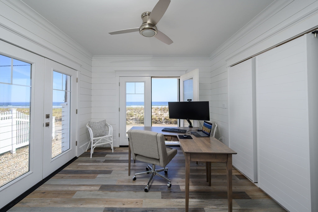 133 Beach Avenue Hull, MA 02045 - Photo 20 of 42 a view of a workspace with furniture and a window