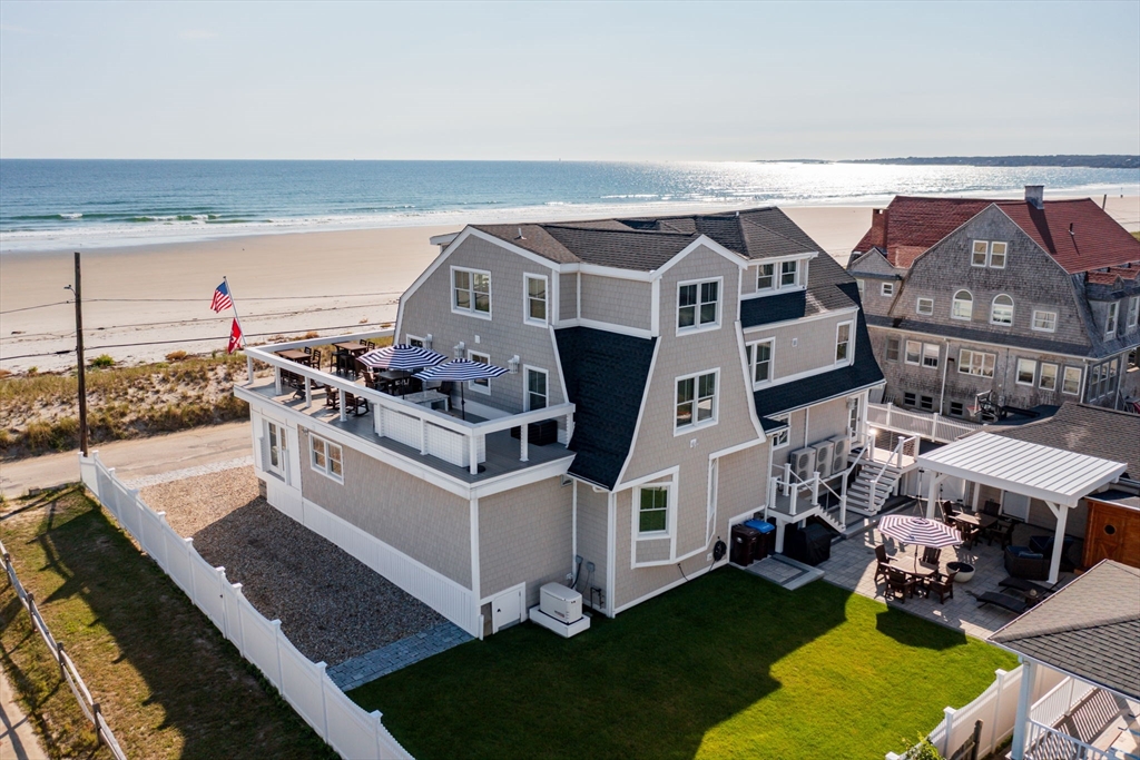 133 Beach Avenue Hull, MA 02045 - Photo 2 of 42 a view of a house with a big yard and sitting area