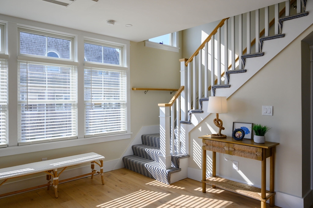 133 Beach Avenue Hull, MA 02045 - Photo 21 of 42 a livingroom with lounge chair and windows