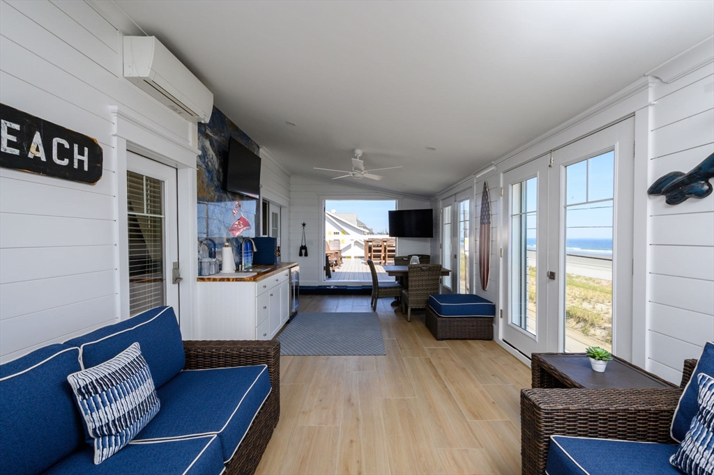 133 Beach Avenue Hull, MA 02045 - Photo 25 of 42 a living room with furniture and a large window