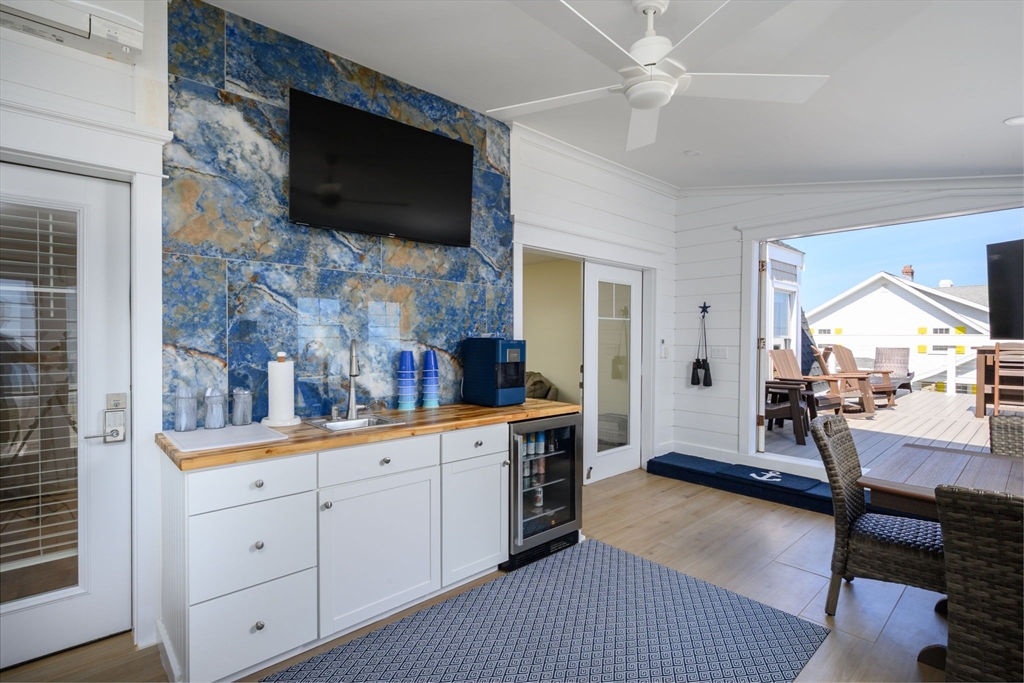 133 Beach Avenue Hull, MA 02045 - Photo 26 of 42 a living room with furniture and a flat screen tv