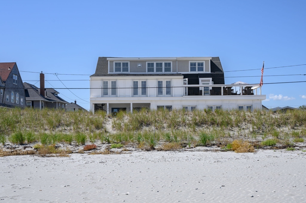 133 Beach Avenue Hull, MA 02045 - Photo 37 of 42 a view of a building with a yard