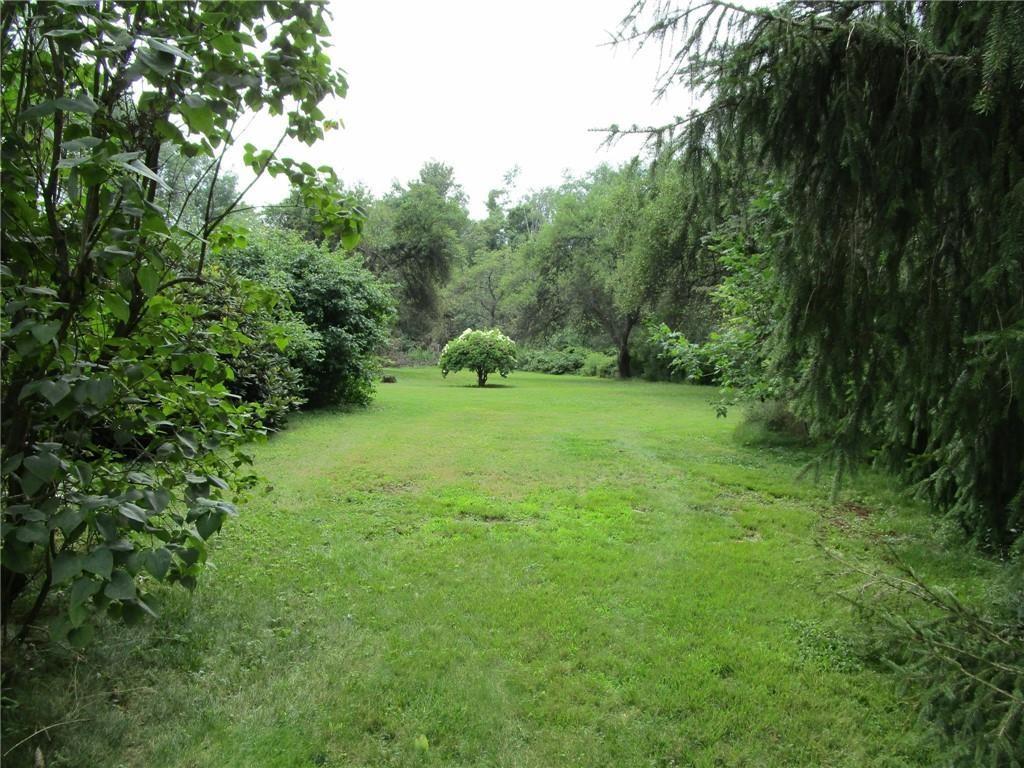 26071 State Rte 27 Guys Mills, PA 16327 - Photo 2 of 16 a view of a green field with lots of bushes